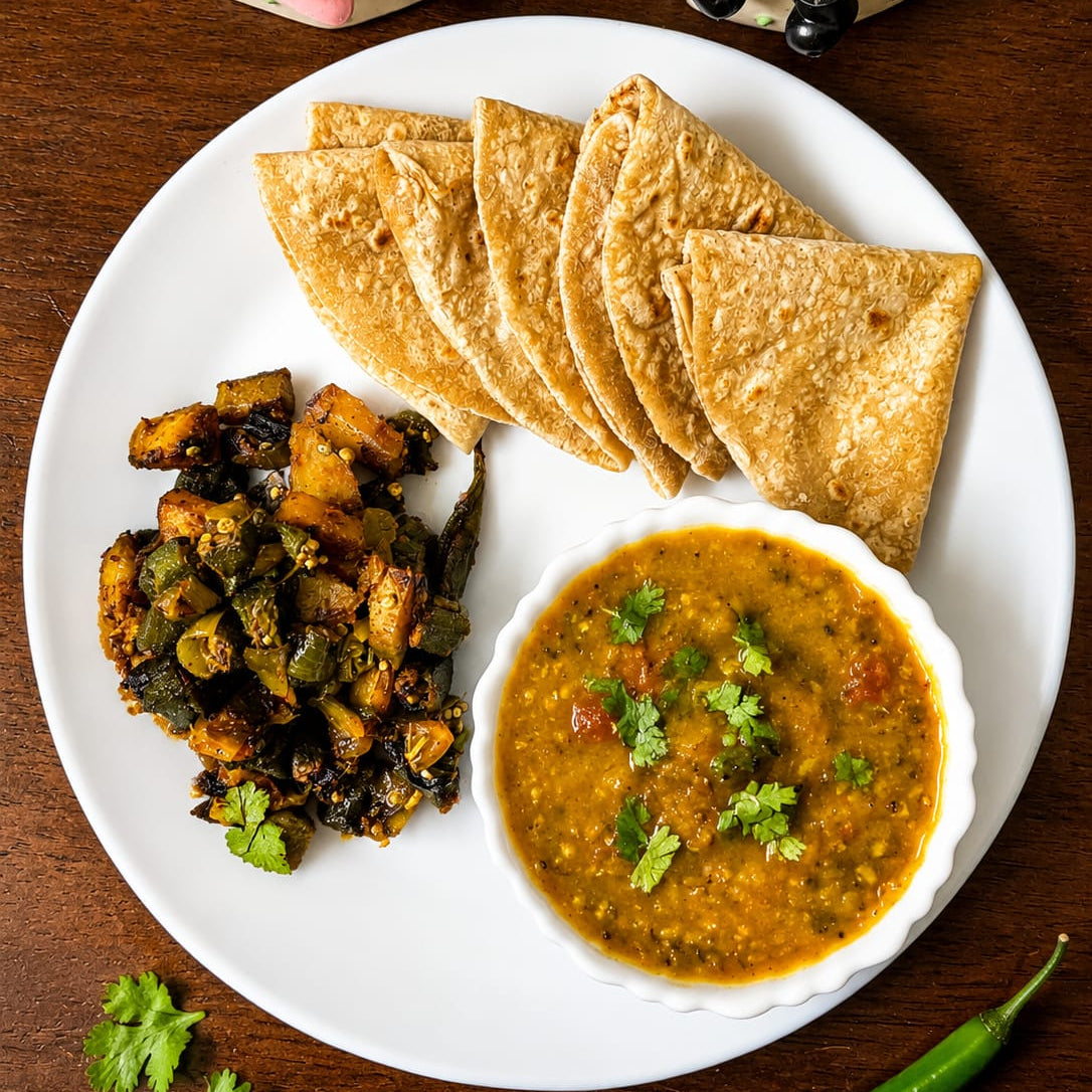 Split Green Moong Dal Tadka with Aloo Bhindi Fry & Ghee Chapatis Thali