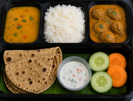 Lauki kofta roti dal rice raita thali